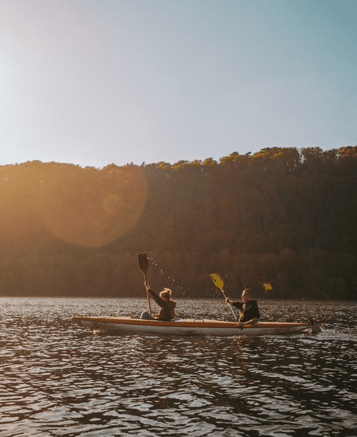 Two people kayaking in the ocean